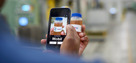A customer using the MLA App to scan the QR code on a sample bottle